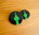 Button Grün auf Schwarz